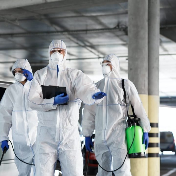 virologists-in-protective-suits-on-duty-on-public-parking-for-first-aid.jpg